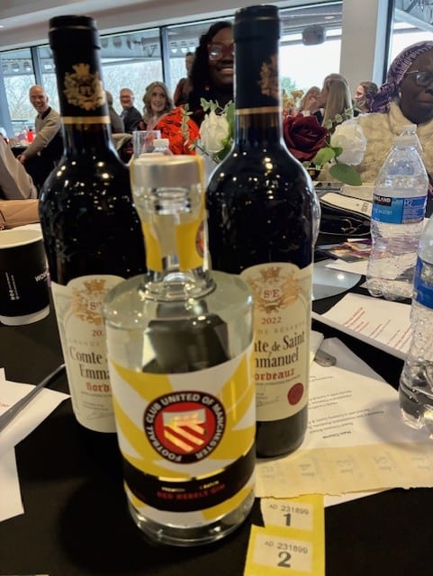 Raffle prizes including wine and FC United Red Rebels gin at the North Manchester International Women’s Day Business Awards event.