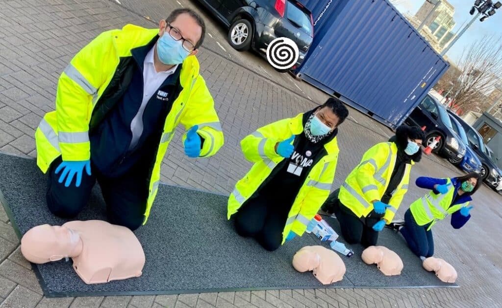 CPR training session showing learners practising chest compressions and AED use as part of the Chain of Survival